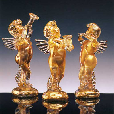 Crystal and gold angel with a trumpet