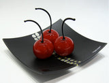 Tray with 3 natural size cherries