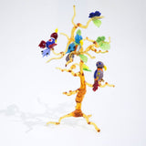 Tre pappagalli su un ramo in vetro di Murano